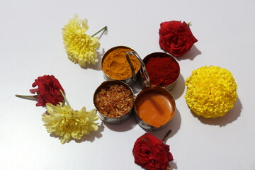 Traditional Hindu Pooja Essential items, Bannana leaf,Turmeric, Kumkum, Mari gold flower Isolated on White Background