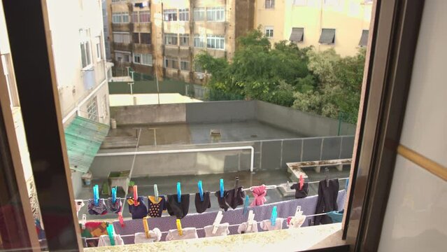 Socks are dried on a rope - view from the window