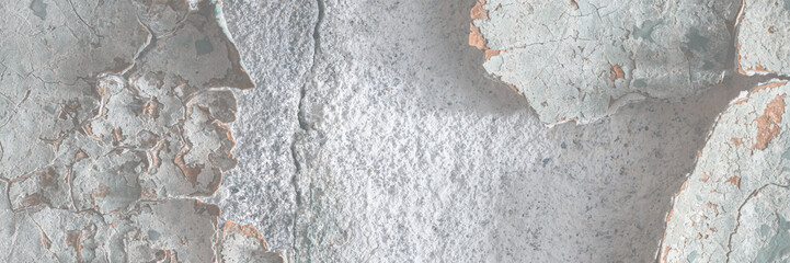 Peeling paint on the wall. Old concrete wall with cracked flaking paint. Weathered rough painted surface with patterns of cracks and peeling. High resolution texture for background and design. Closeup