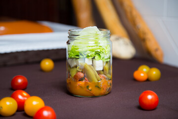 Delicious and healthy salad with cheese and a variety of vegetables and tomatoes.