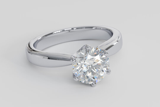 Diamond solitaire engagement ring with a round brilliant cut stone on white background. 3d rendering