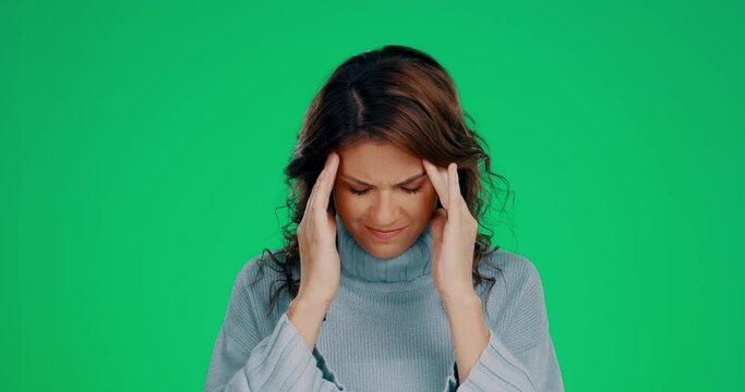 Woman, green screen or stress headache in studio for mental health, anxiety and pain with hands on head. Frustrated, model and psychology problem for trauma, depression or angry mindset by background