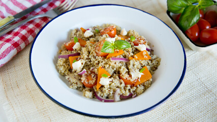 Delicious green salad with quinoa and vegetables.
