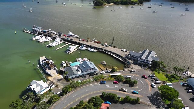 aerial view of bay of islands New Zealand with ferry port and sail boat on the ocean cursing the archipelago islands in NZ