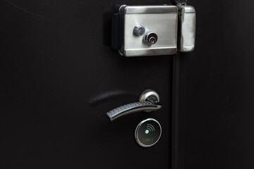 Door handle in the interior. Knob close-up elements. Open and closed light wooden doors in in modern style in the interior. Door handle, fittings for interior design. Home apartment interior