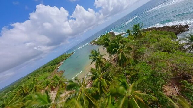 FPV - Waves Crashing On Rocky Shoreline Of Playa Los Coquitos In Summer In Cabrera, Dominica, Republic. - aerial