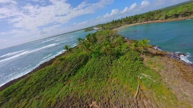 Foamy White Waves Hitting The Shore Of Playa Los Coquitos On A Sunny Summer Day In Dominican Republic. - aerial FPV