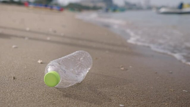 volunteering,charity,microplastic,cleaning,people picking up plastic bottle cleaning on the beach.,agriculture and climate change,microplastic waste.food industry and plastic packaging.