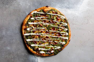 Spinach Bacon Pizza served in dish isolated on table top view of arabic breakfast