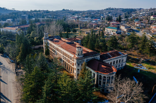 Aerial view of ruined overgrown old abandoned Soviet sanatorium Iberia, Tskaltubo, Georgia