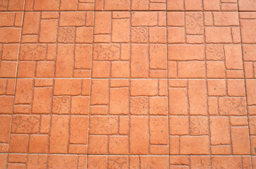 Light brown cladding tiles imitating stone on wall close