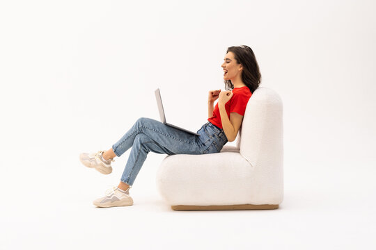Beautiful woman working with a laptop, isolated over white background