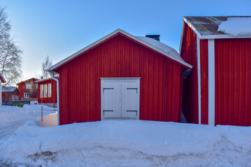 Rows with red huts in Gammelstad church town located near the Swedish town Lulea.