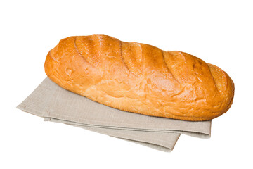 Freshly baked delicious french bread with napkin isolated on white background top view. Healthy white bread loaf
