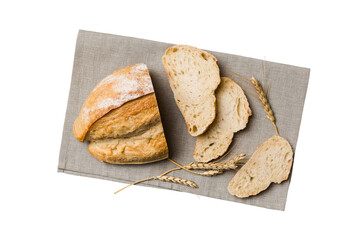 Freshly baked bread slices on napkin against isolated on white background. top view Sliced bread