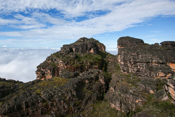 Fototapeta na wymiar Steep and eroded sandstone cliffs of Auyan tepui, a famous table mountain in Venezuela