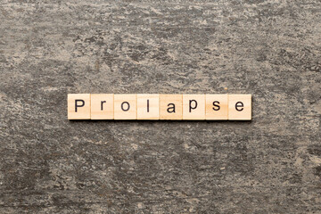 prolapse word written on wood block. prolapse text on table, concept