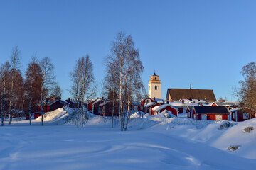 Rows with red huts in Gammelstad church town located near the Swedish town Lulea.
