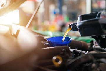 Auomobile repair, Refueling and pouring oil quality into the engine motor car Transmission and...
