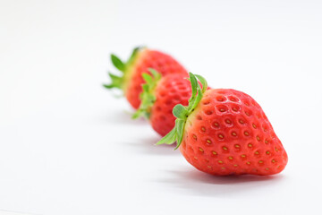 beautiful three fresh red strawberry isolated on white background
