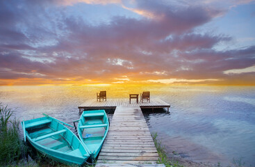 Boats, jetty and beautiful colourful sunset
