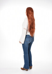 Obraz premium full length portrait of beautiful woman model with long red hair, wearing casual outfit white blouse top and denim jeans, isolated on white studio background. Backwards standing pose, walking away fr