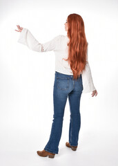 full length portrait of beautiful woman model with long red hair, wearing casual outfit white...