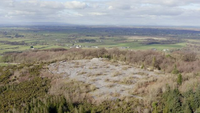 Establishing aerial shot over Finvarra castle and Caesar's Cairn on Knockma Hill