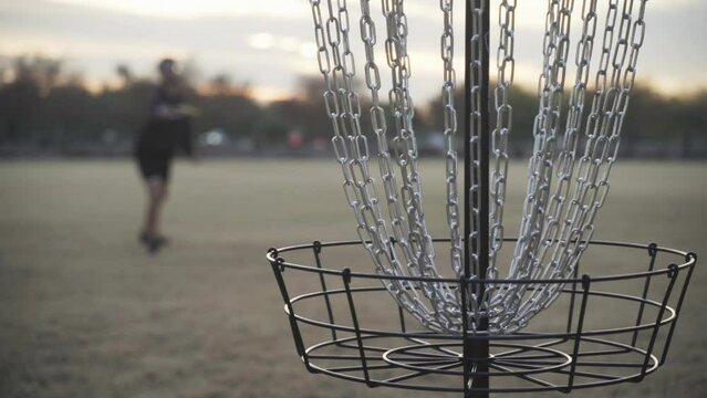 Disc Golfer Misses Birdie Putt by hitting the Cage of the Disc Golf Basket