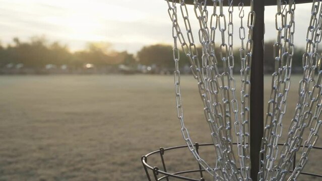 Disc Golf Putt Made During Sunset | Slow Motion of Disc Golf Basket