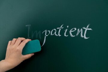 Change impatient to patient on blackboard - obrazy, fototapety, plakaty