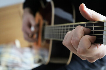 beautiful guitar in the hands of men playing the instrument