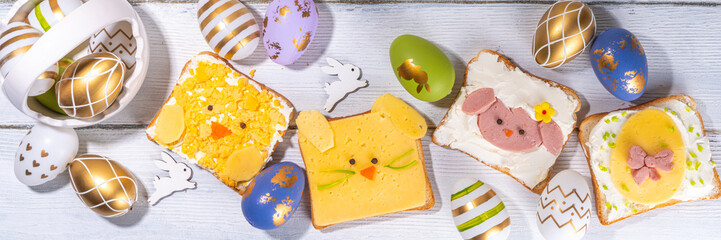 Cute funny Easter breakfast for kids. Homemade sandwiches, sandwiches in the form of symbols of the...