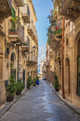 Fototapeta na wymiar Typical street on the island of Ortigia Syracuse in Sicily
