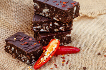 Chili chocolate brownies on rustic table