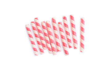 Pink striped wafer stick rolls isolated on white background, Strawberry flavour