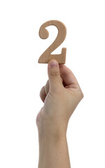 Hand holding wooden number 2