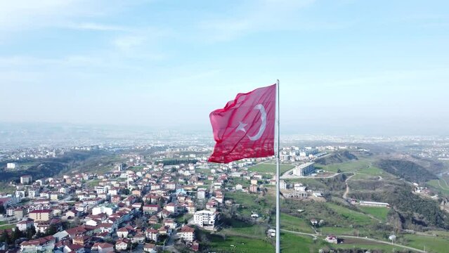 Turkish flag on top of the mountain. Turkish flag at the top with beautiful view. Turkish National holidays. 23 Nisan, 19 Mayis, 30 Agustos, 29 Ekim concept. Drone view. Aerial cinematic shot.