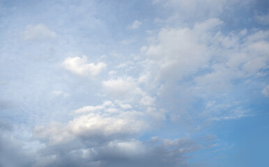 Naklejka na ściany i meble White fluffy clouds on blue sky in summer