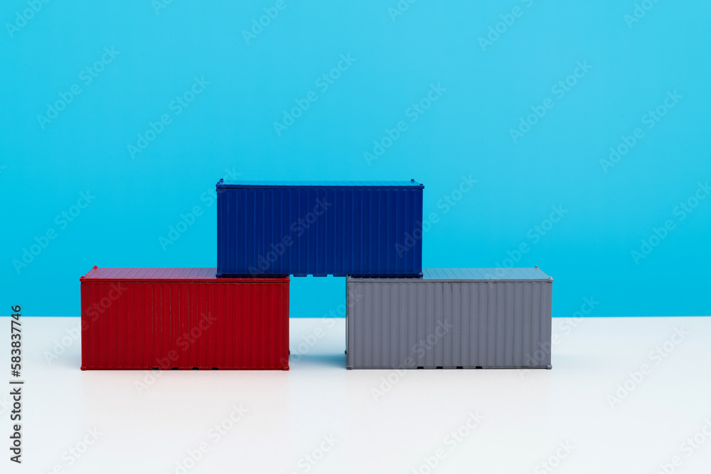 Poster Three cargo containers on the table