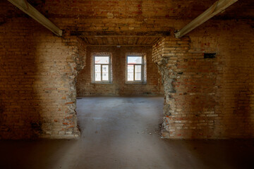 Fototapeta na wymiar Old grunge interior with a destroyed brick wall
