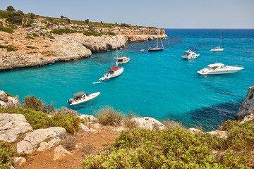 Fototapeta na wymiar Turquoise waters in Mallorca. Pilota cove. Mediterranean coastline. Balearic islands