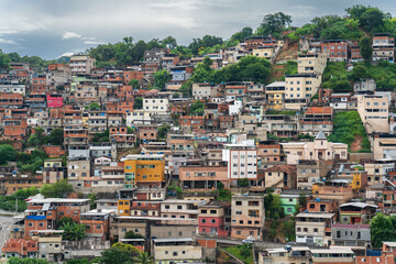 Fototapeta na wymiar Colorful Favelas Covering Mountain Slope
