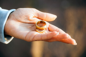 wedding rings in hands. Wedding hand. Rings. Golden. Photo. Background. Love. 