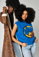 Portrait of african american couple wear stylish  90s fashion clothes with afro hairstyle isolated on gray background - 583843968