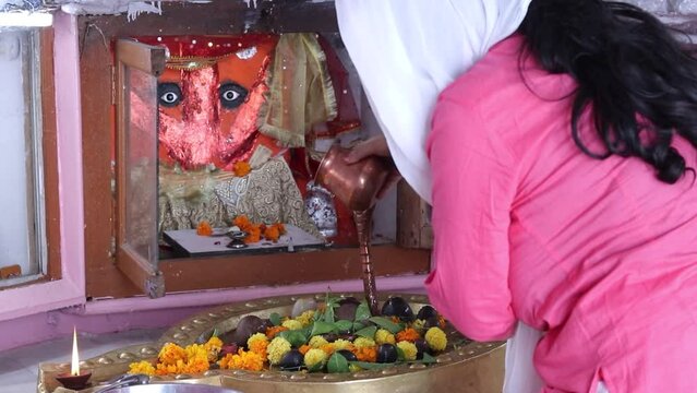 devotee prying of lord shiva at temple from flat angle