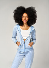 Beautiful african american girl with an afro hairstyle wear blue velour tracksuit