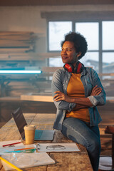 Portrait of female carpenter at work.