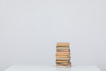 a stack of books is on the table in the library science knowledge education