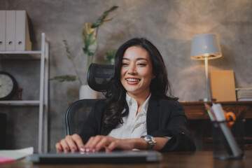 A happy and joyful Asian business woman feeling triumph, winner and achievement. A Female...